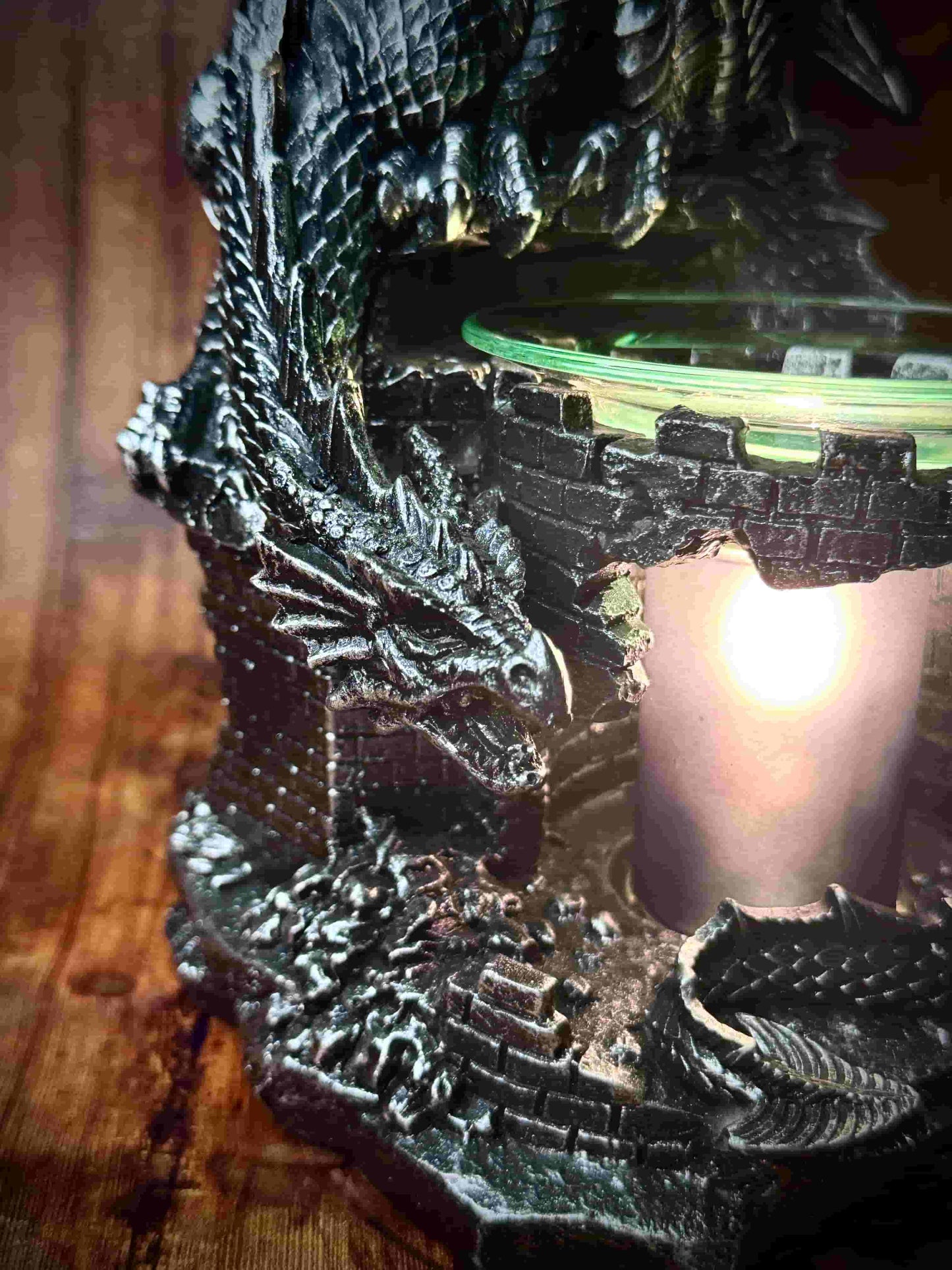 Herbal Hollow Co fantasy-themed electric wax and oil melter shaped like a dragon wrapped around a castle wall, perfect for magical home décor