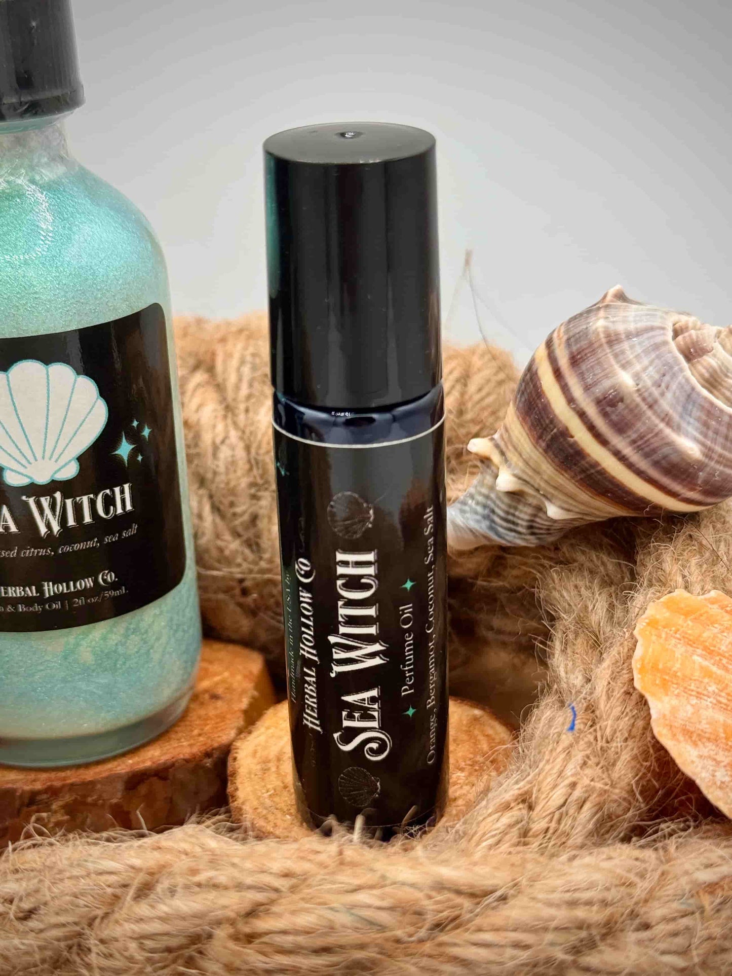 Sea Witch perfume oil product on wooden surface.