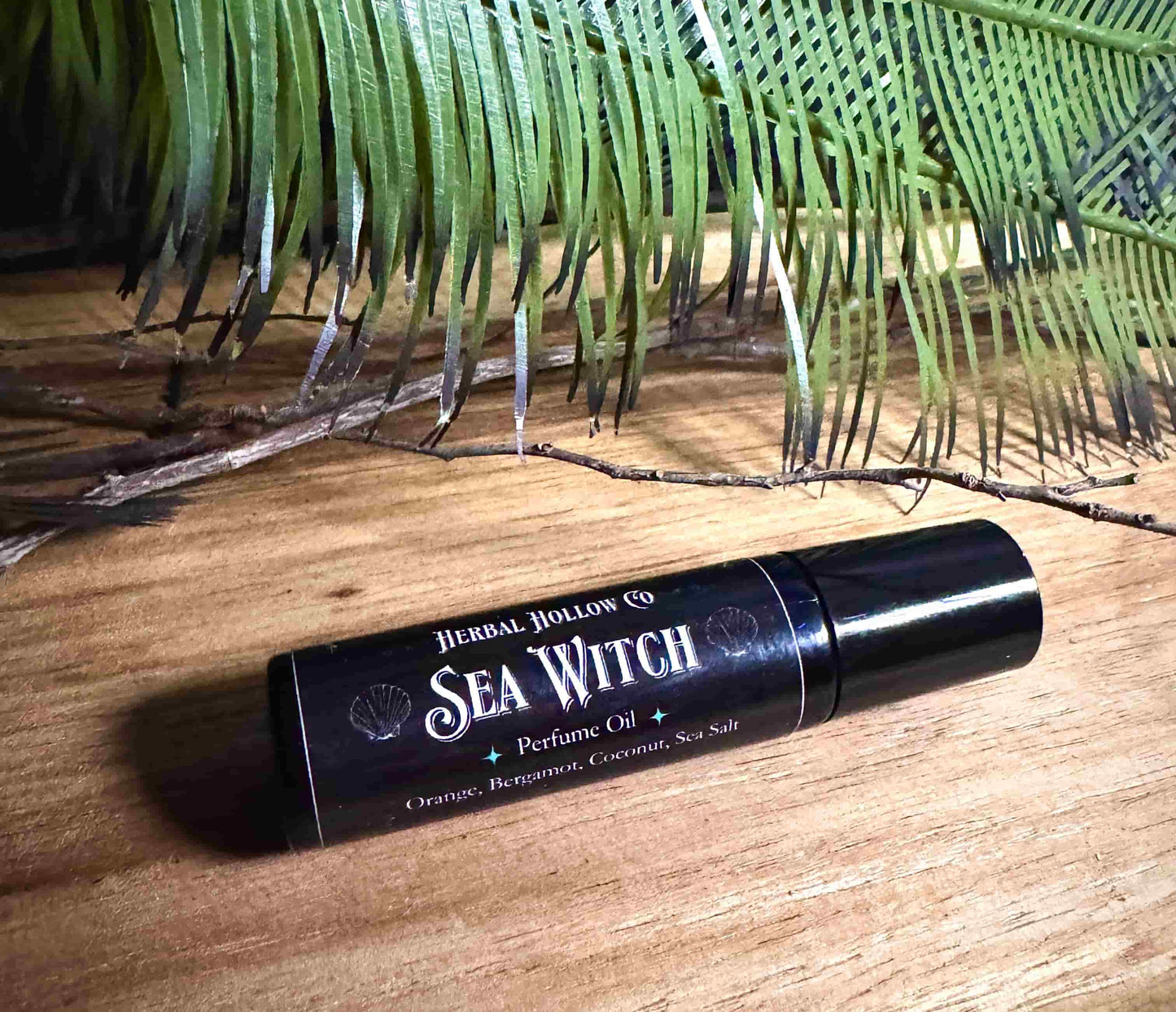Sea Witch fantasy-inspired rollerball fragrance oil perfume, featuring a handcrafted magical floral and coconut scent in a portable glass bottle.