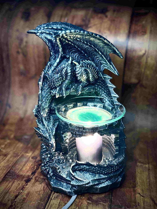 Herbal Hollow Co fantasy-themed electric wax and oil melter shaped like a dragon wrapped around a castle wall, perfect for magical home décor