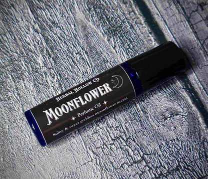 Moonflower dark fantasy-inspired witchy rollerball fragrance oil perfume, featuring a handcrafted magical floral and agave scent in a portable glass bottle.