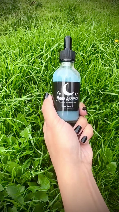 Video of Herbal Hollow Co Moon Essence shimmering body oil with hydrating formula and gold glitter, inspired by fantasy and celestial beauty.
