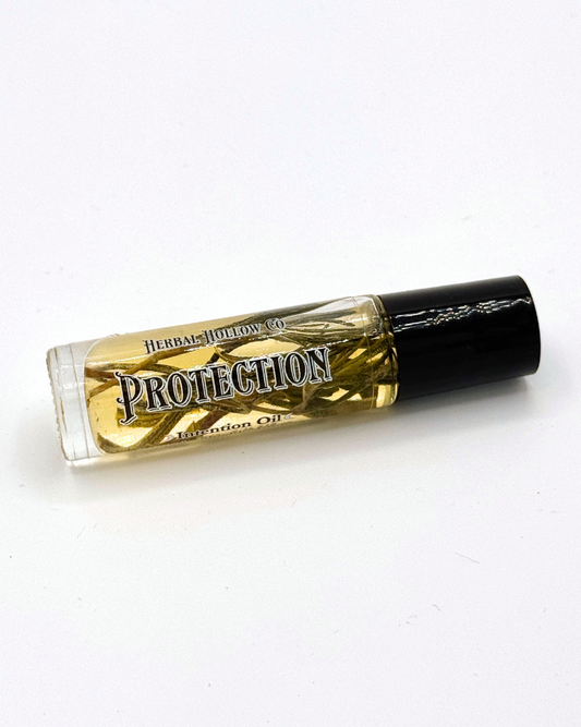 Rollerball perfume bottle labeled 'Protection' with black cap on a white background.